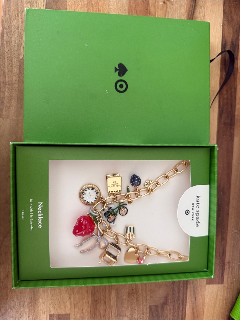 kate spade gold-tone charm necklace with red strawberry and black accents